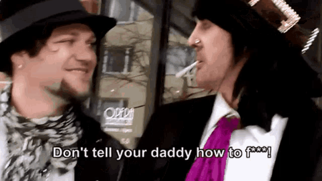 a man smoking a cigarette next to another man who says " don 't tell your daddy how to f *** ! "