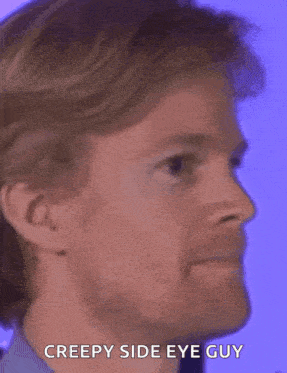 a close up of a man 's face with the words creepy side eye guy below it