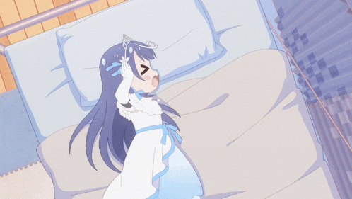 a girl laying on a bed with a crown on her head