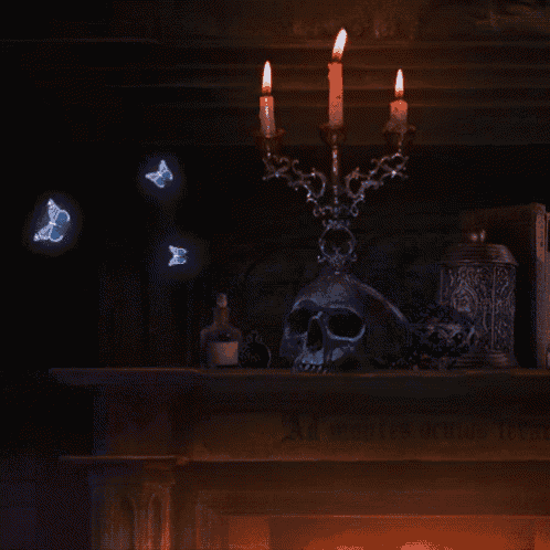 a skull sits on a mantle with candles and butterflies flying around