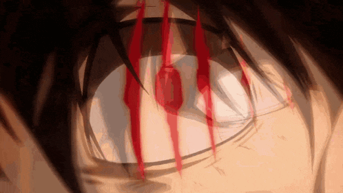 a close up of a man 's eye with blood coming out of it .
