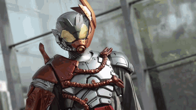 a close up of a superhero with a helmet on