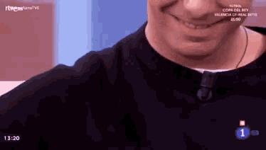 a close up of a man 's face with the number 1 on the bottom