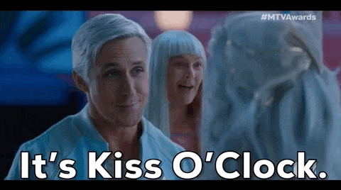 a man with gray hair is standing next to a woman with blue hair and says it 's kiss o ' clock .