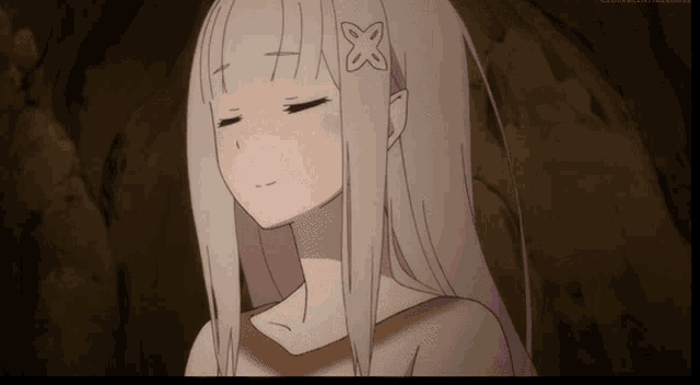a girl with a cross on her forehead and a flower in her hair