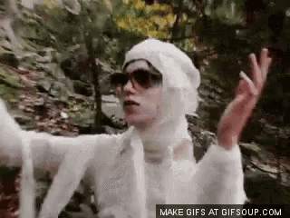 a person with a bandage on their head and sunglasses is making a gif at gifsoup.com