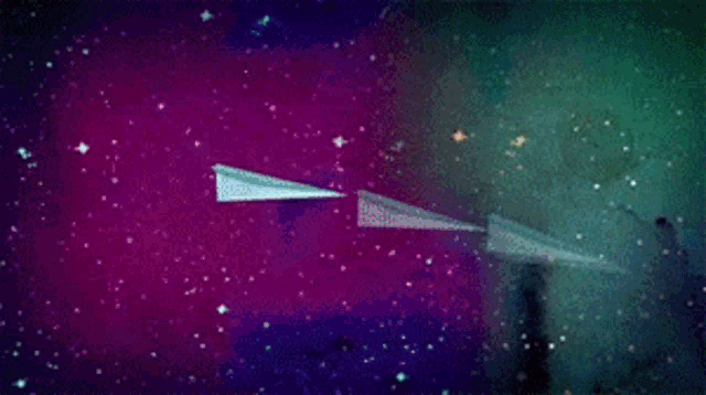a paper airplane is flying through a colorful space background