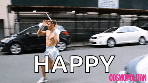 a man is running down a street with the words happy cosmopolitan on the bottom right