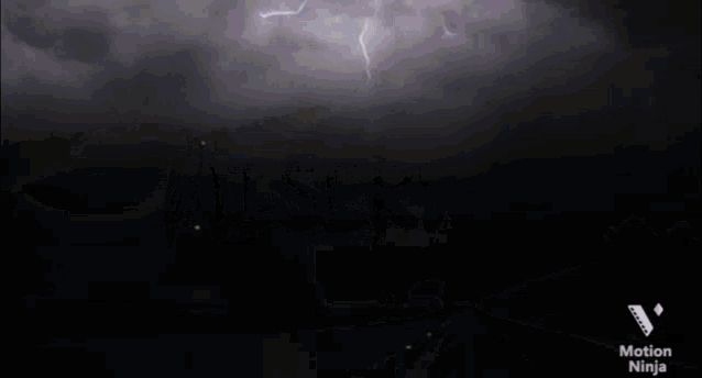 a screen shot of a lightning storm with the words motion ninja on the bottom right