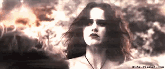 a close up of a woman 's face with the website gifs-planet.com in the corner