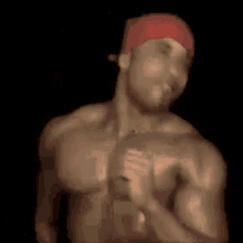 a man with a red hat on his head is sitting down