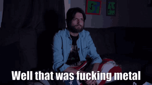 a man sitting on a couch with the words well that was fucking metal written below him