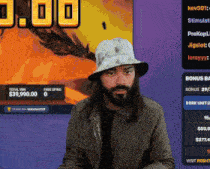a man with long hair and a beard is playing a game