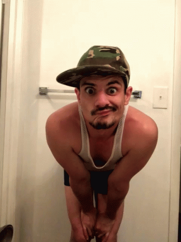 Guy With Cap Squatting GIF - Guy With Cap Squatting Eye Roll GIFs