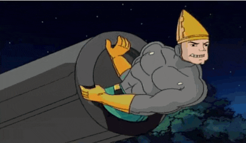 a cartoon character with a cone on his head is sitting on a tire .