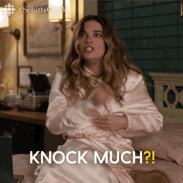 a woman sitting on a bed with the words knock much written on the bottom