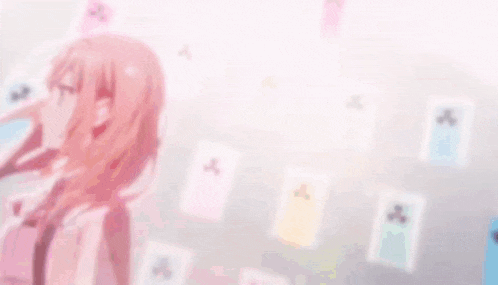a girl with long hair and glasses stands in front of a bunch of papers
