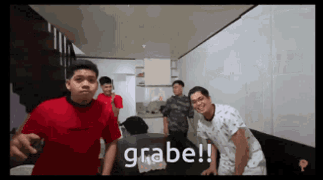 a group of young men standing in a room with the word grabe written on the bottom