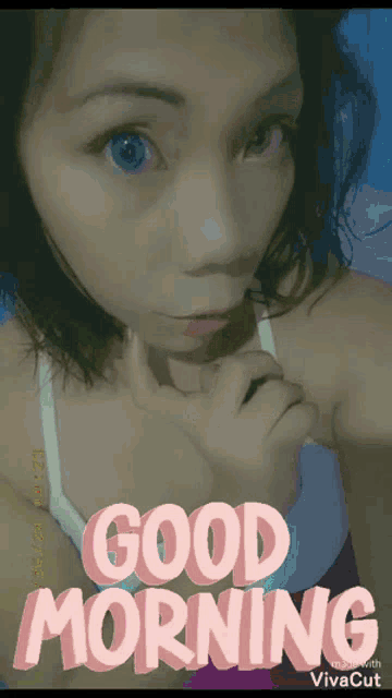 a woman is taking a selfie with the words " good morning " written above her