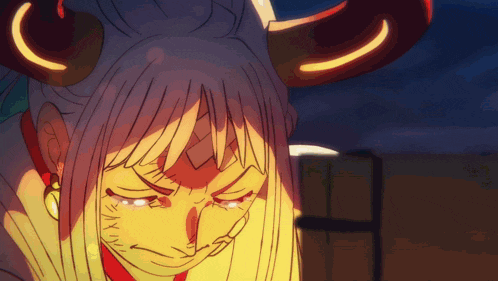 a close up of a cartoon character with horns and a sad look on her face