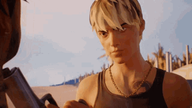 a man with blonde hair and a gold chain around his neck
