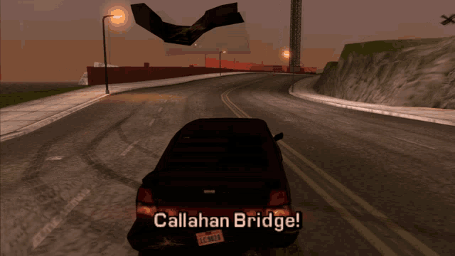a car with a license plate that says callahan bridge drives down a road