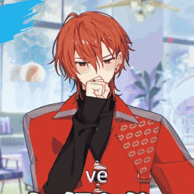 a man with red hair is wearing a red jacket and a black sweater