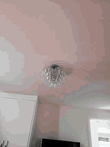 a white wall with a light on it