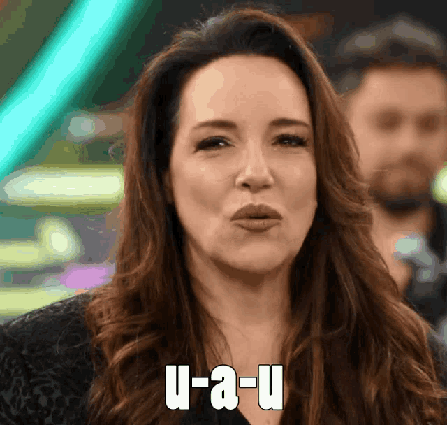 a woman with u-a-u on her face making a funny face