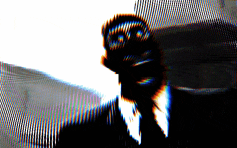a blurry image of a man in a suit