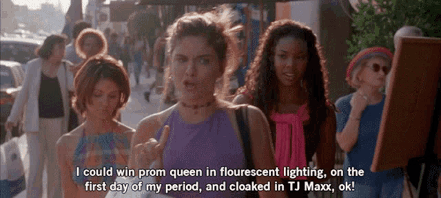 a woman in a purple top says " i could win prom queen in fluorescent lighting "