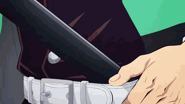 a person is holding a sword in their hand