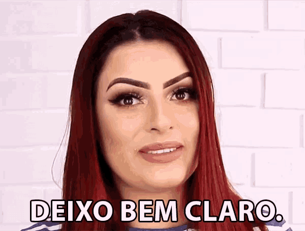 a woman with red hair and the words deixo bem claro on her face