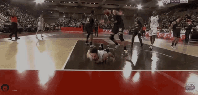 a basketball game is being played in a stadium sponsored by bein sports