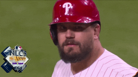 a man with a beard wears a red helmet with the letter p on it
