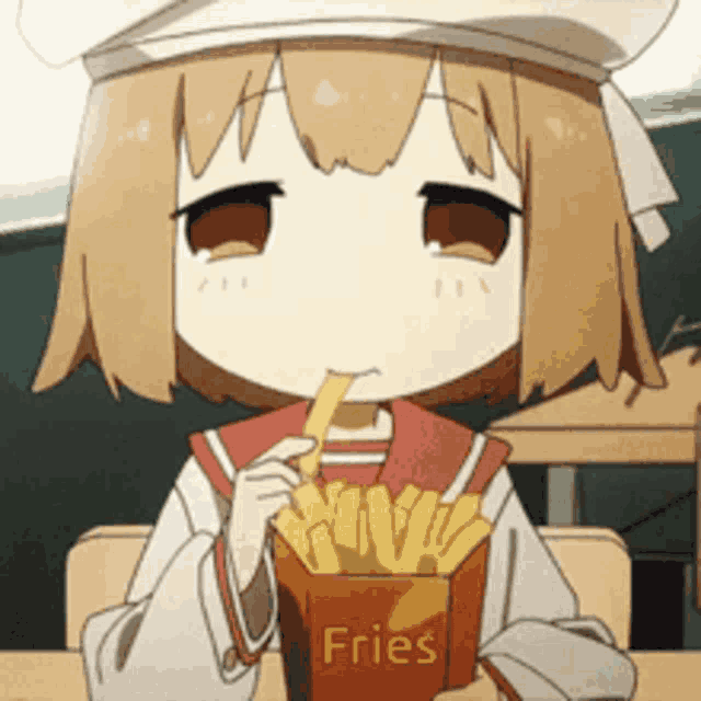 a little girl is eating french fries in a box