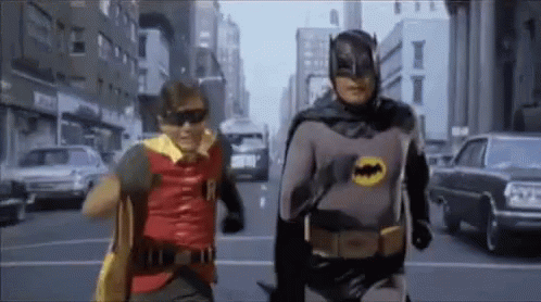 Batman And Robin Running Away GIF