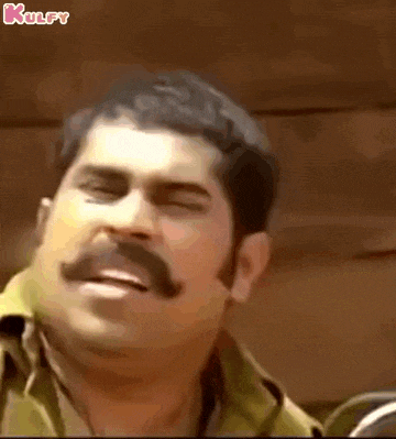 a man with a mustache is making a funny face with his eyes closed and his mouth open .