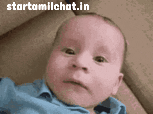 a baby is making a funny face and the website starttamilchat.in is above it