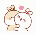 a couple of rabbits kissing each other with a heart in the air .