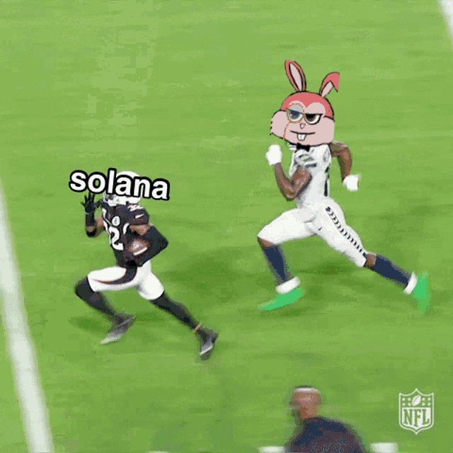 a football player is laying on his back on the field with the nfl logo in the corner