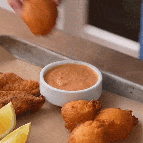 Dipping Fritters In The Sauce Brian Lagerstrom GIF - Dipping Fritters In The Sauce Brian Lagerstrom Putting Sauce In The Fritters GIFs