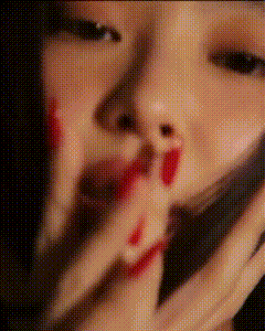 a close up of a woman 's face with blood coming out of her nose and mouth .
