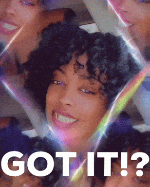 a woman with curly hair is smiling with the words got it behind her