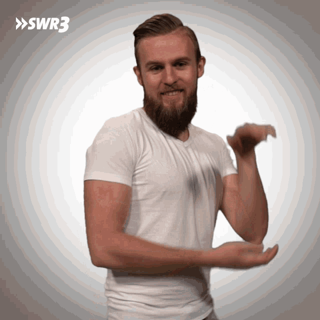 a man with a beard is wearing a white shirt with swr3 written on the bottom