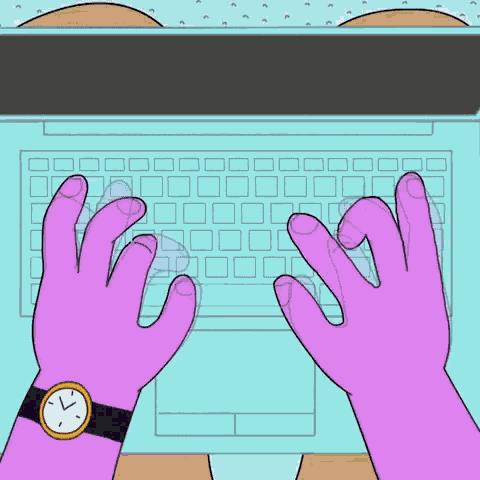 a person wearing a watch is typing on a laptop computer .