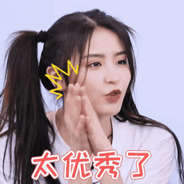 a girl with ponytails and chinese writing on her shirt