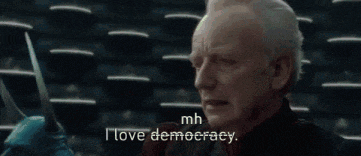 a man is holding a knife and saying `` i love democracy . ''