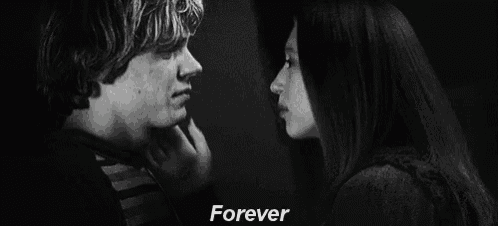 a black and white photo of a man 's face with the words `` forever '' written above him .