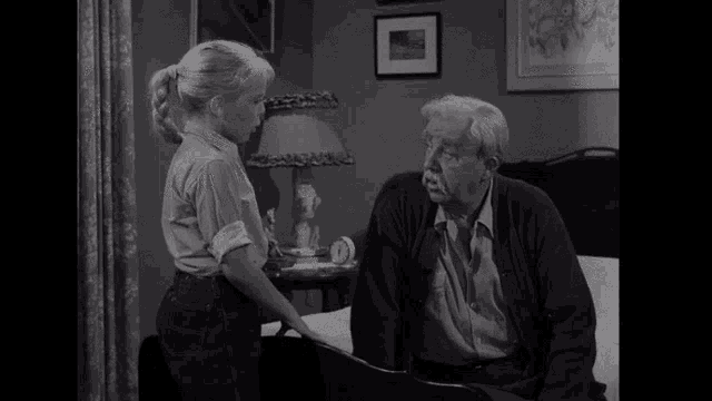 a black and white photo of a man and a girl with what 'd you do rob a bank in yellow letters